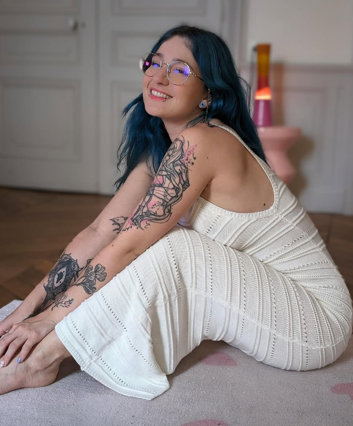 Khalamite, a blue-haired French OnlyFans creator from Lyon, in a white dress