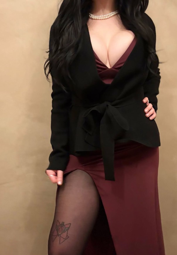 CottontailVA, a Canadian OnlyFans creator and Vtuber in a maroon dress