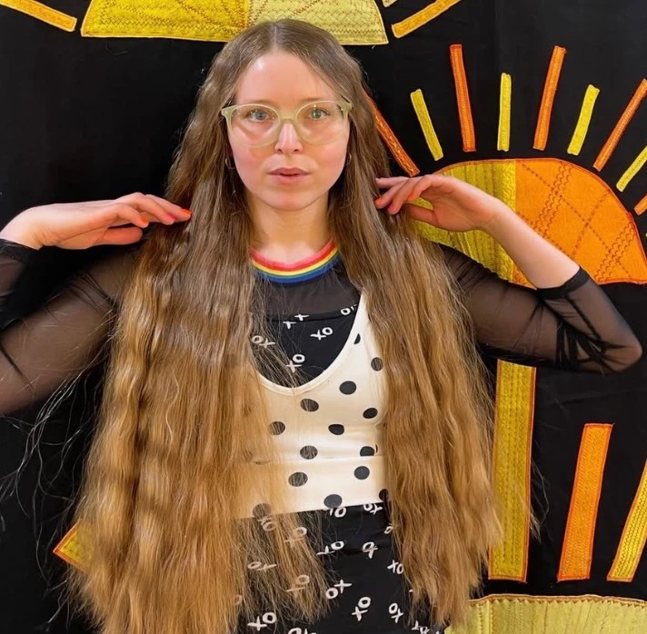 Jessie Cave, British actress and celebrity OnlyFans creator, with her signature long hair