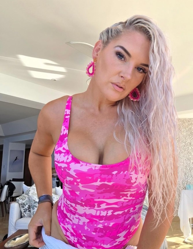 Lacey Evans, former WWE Superstar and OnlyFans creator Macey Estrella, in pink camo