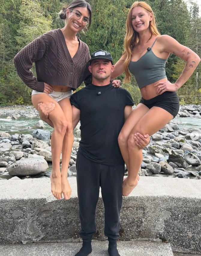Matt and Jessi Moore photographed outdoors by a river
