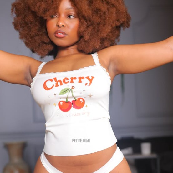 Nokwanda Mkhize, South African ebony OnlyFans creator Petite Tumi, in a white Cherry crop top