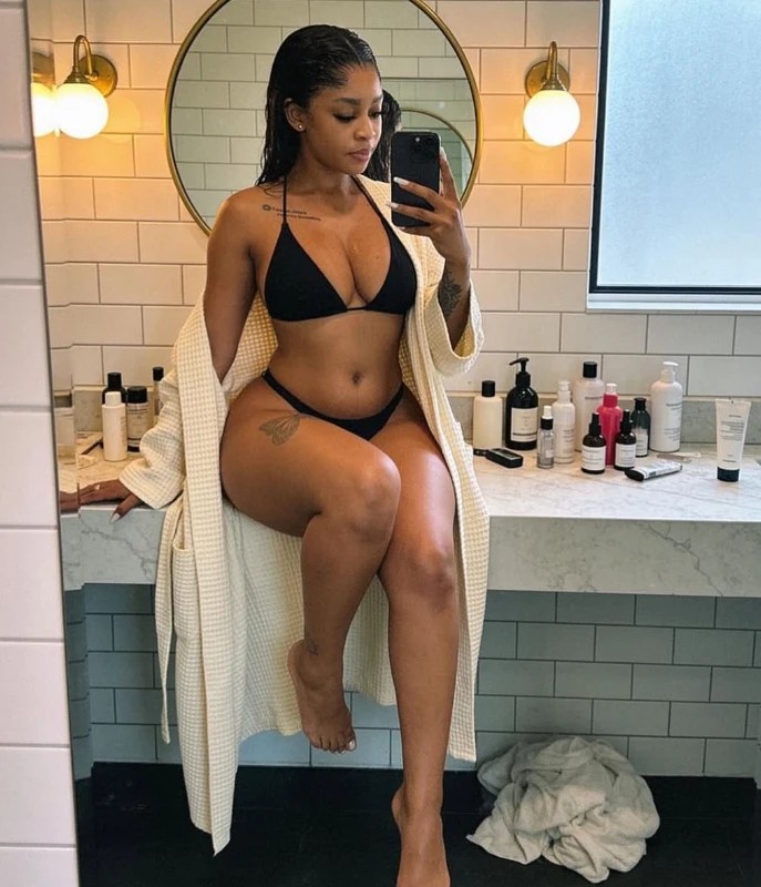 Juicy Pandora, Gen-Z South African OnlyFans model, bathroom mirror selfie in black swimwear