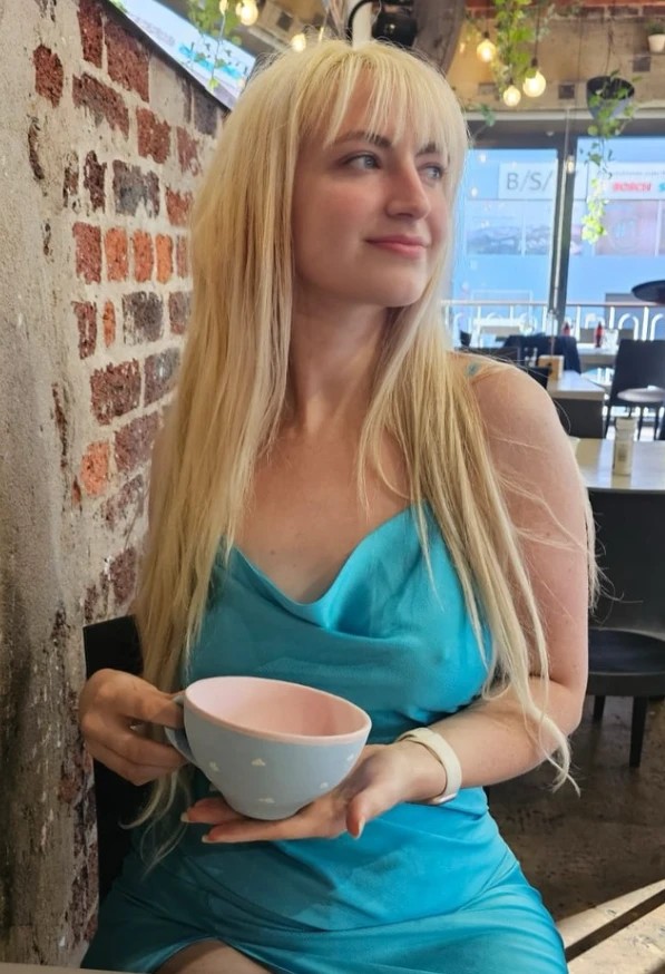 Chevonne Ball, South African Twitch streamer and OnlyFans model MistressMord, in a teal dress